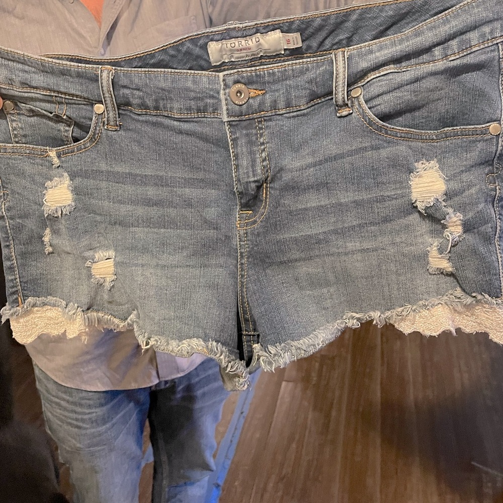 Distressed lace denim shorts